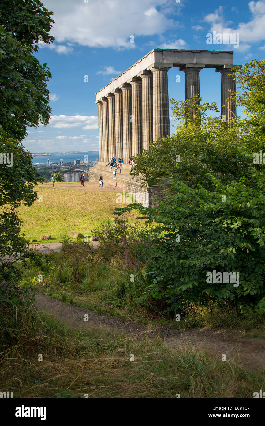 Tourists below the unfinished National Monument on Calton Hill, Edinburgh, Lothian, Scotland Stock Photo