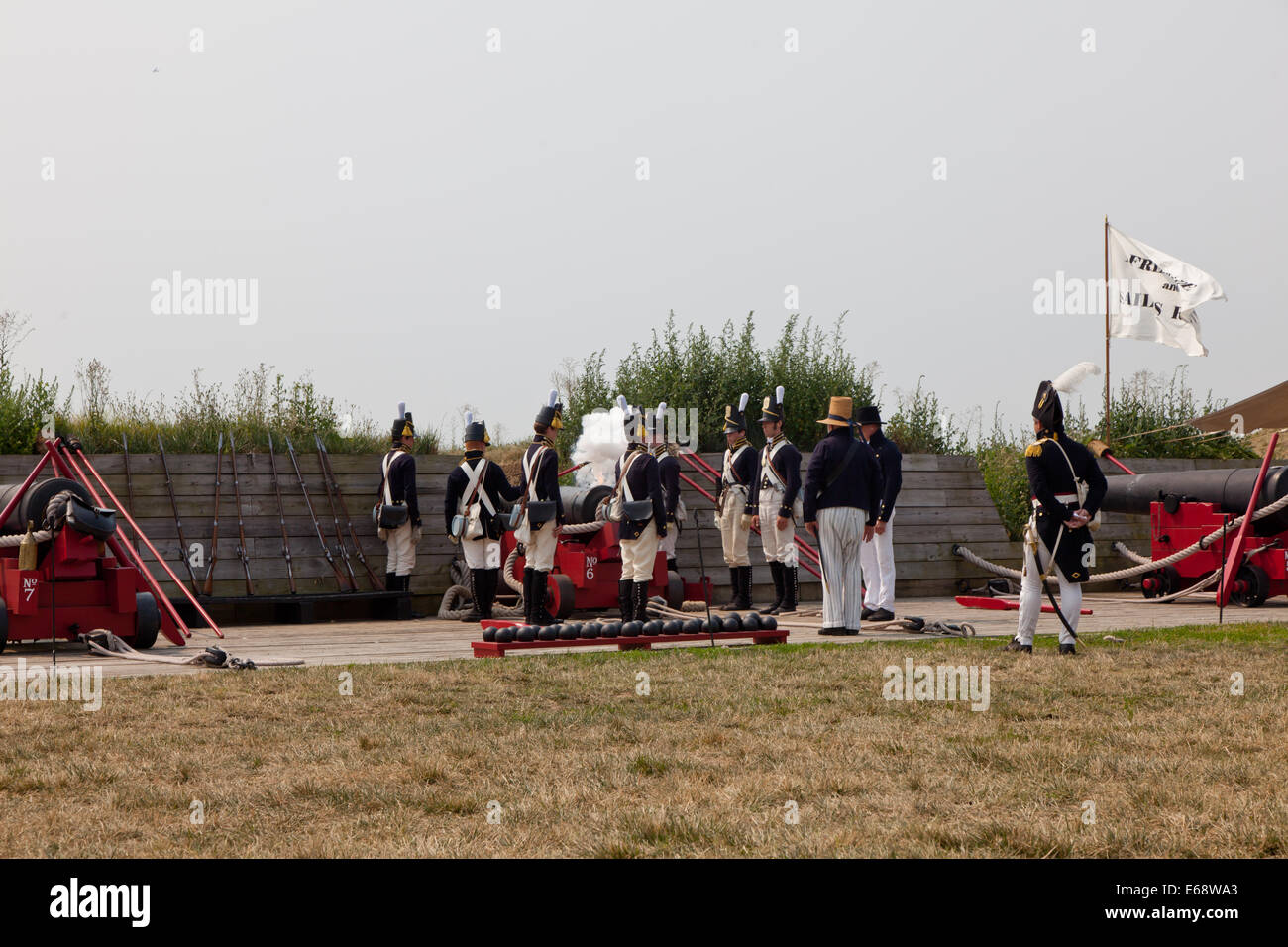 The reenactors lighting the fuze on a cannon during the demonstration Fort McHenry National Historic Site in Baltimore, Maryland Stock Photo