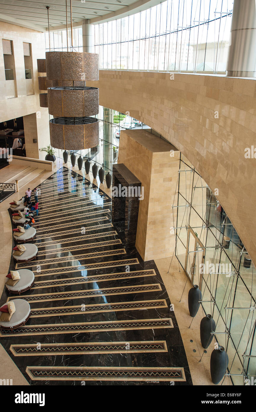 Entrance lobby lounge driveway fountain seats of the Raffles Dubai Hotel Dubai, United Arab Emirates UAE. Stock Photo