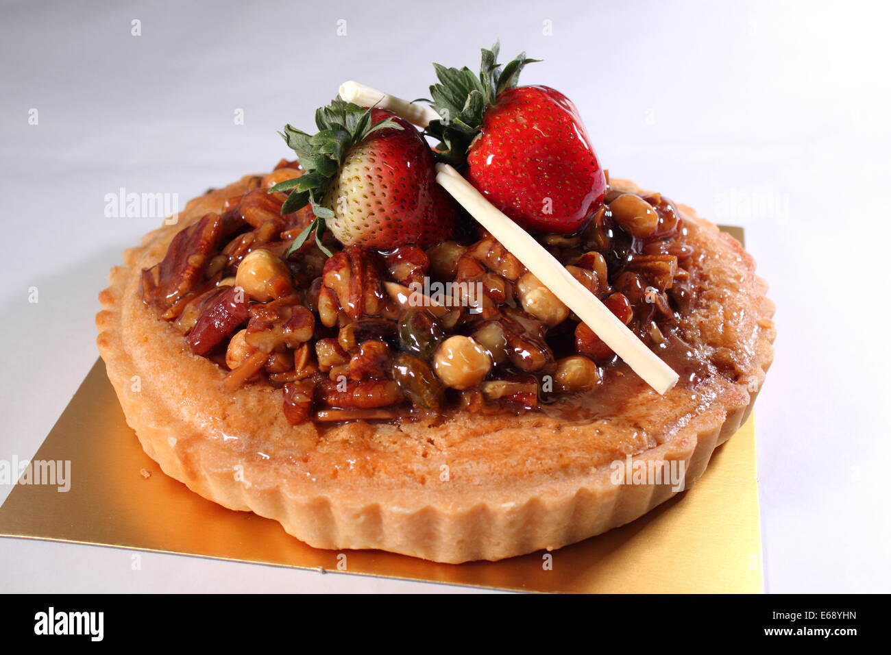 A Mixed nuts pie decorated with strawberry Stock Photo Alamy