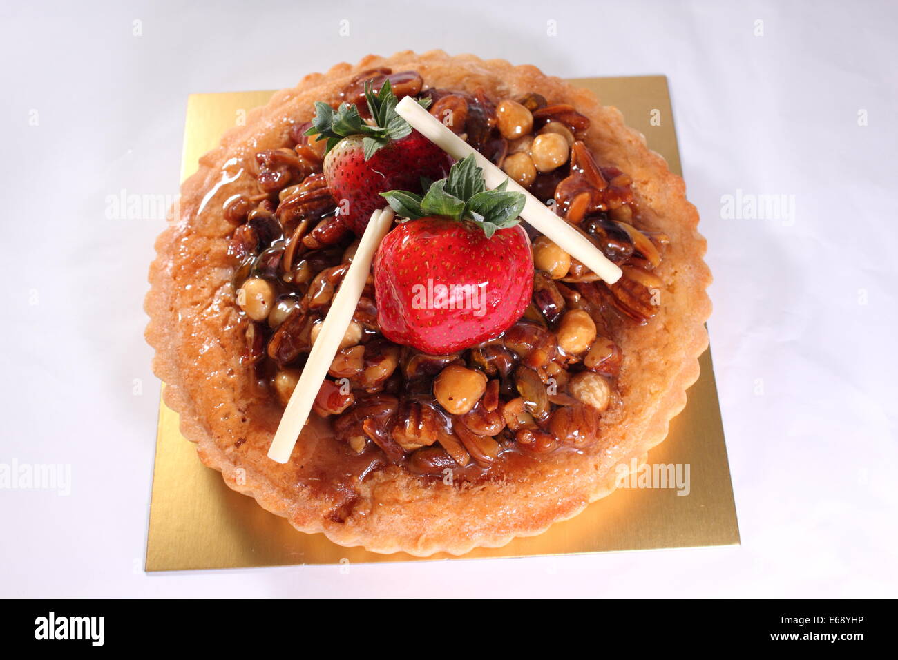 A Mixed nuts pie decorated with strawberry Stock Photo Alamy