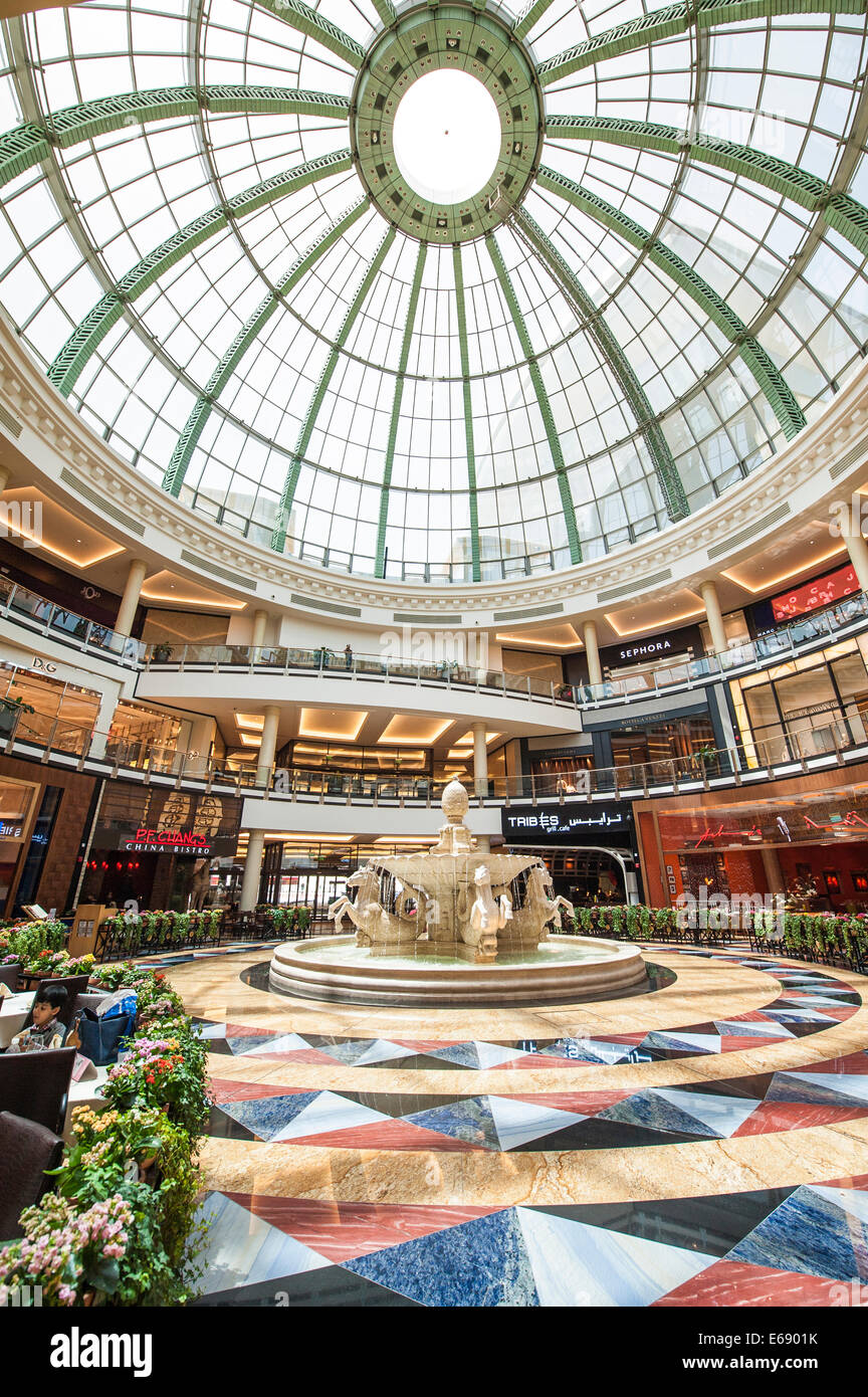 Fountain restaurant cafe in glass atrium shops stores retail in Mall of