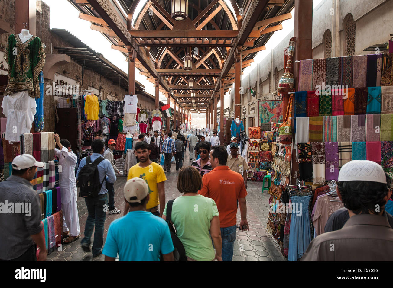 Shoppers shopping in Textile Souk in Bur Dubai, Dubai, United Arab Emirates (UAE). Stock Photo
