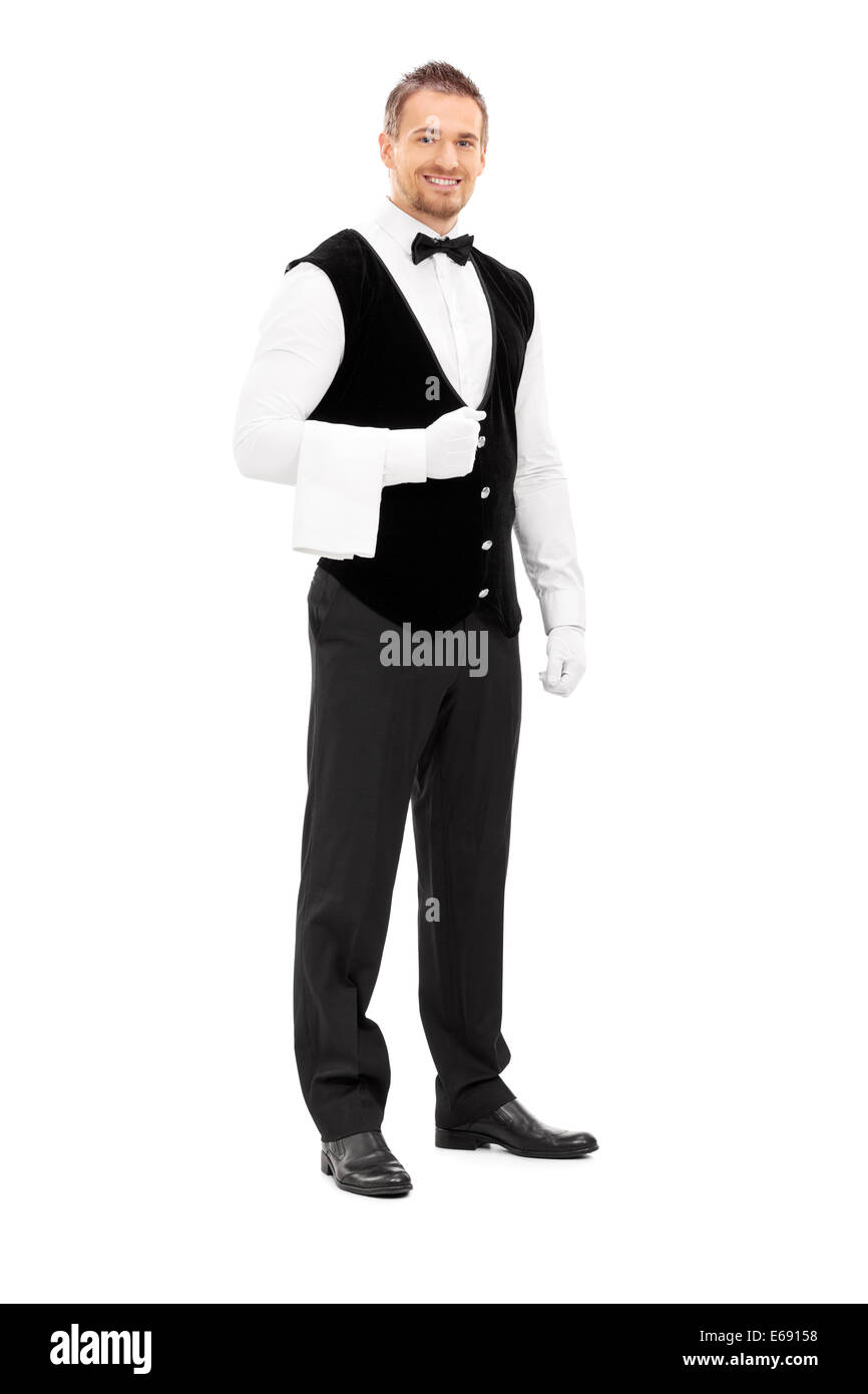 Full length portrait of a professional waiter with a towel around his arm Stock Photo