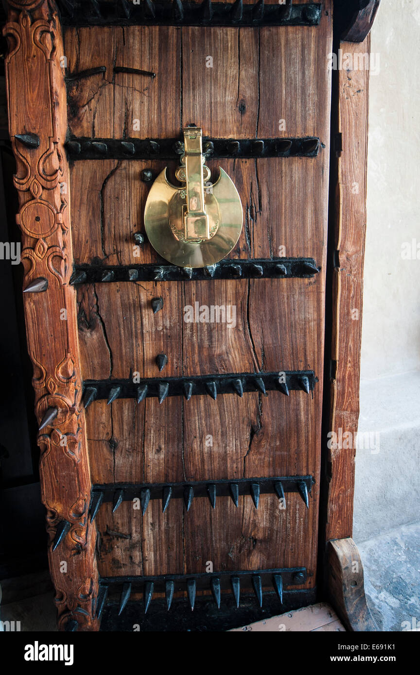 Ornate armored armoured wooden entrance door gate of the Dubai Museum