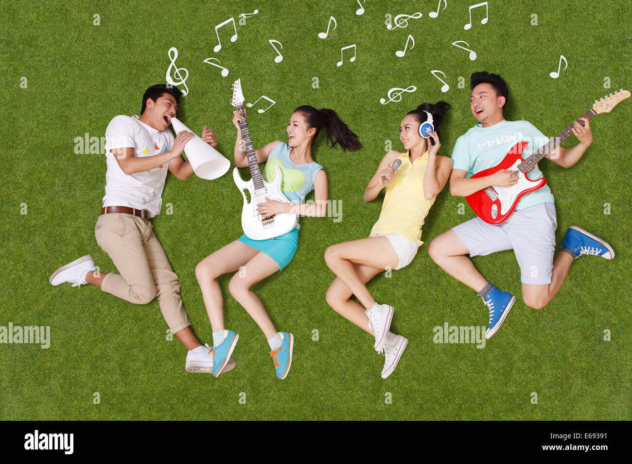 Young people on grass playing musical instruments Stock Photo - Alamy