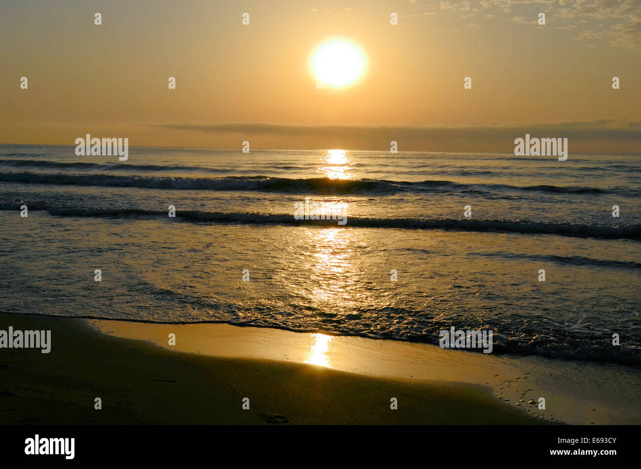 A sunrise on a Spanish beach Stock Photo Alamy