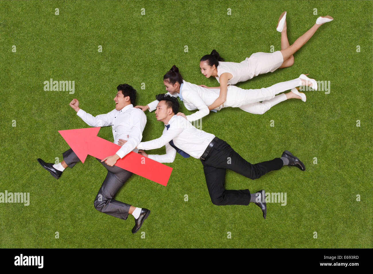 young business people with red arrow Stock Photo - Alamy
