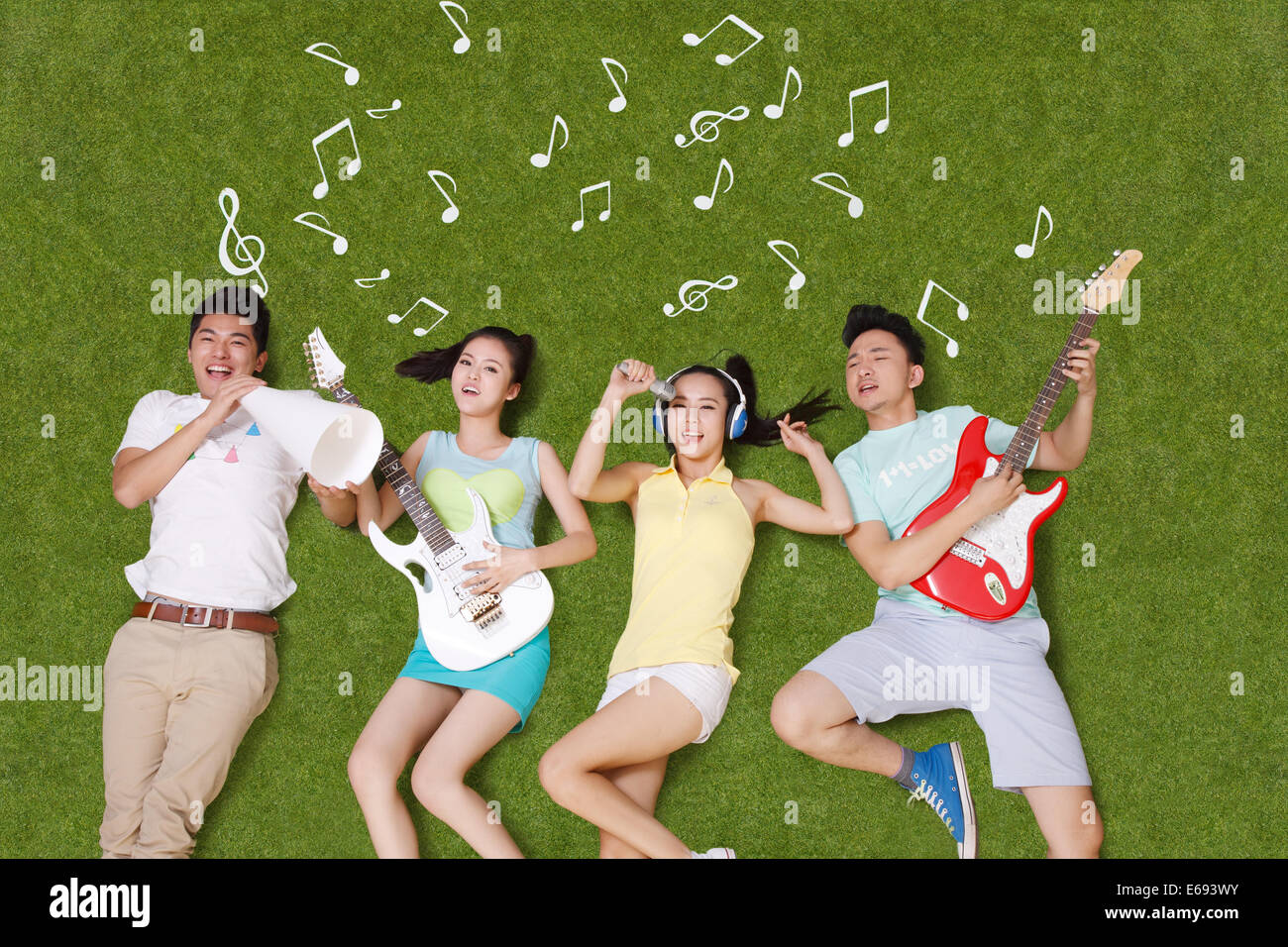Young people on grass playing musical instruments Stock Photo - Alamy