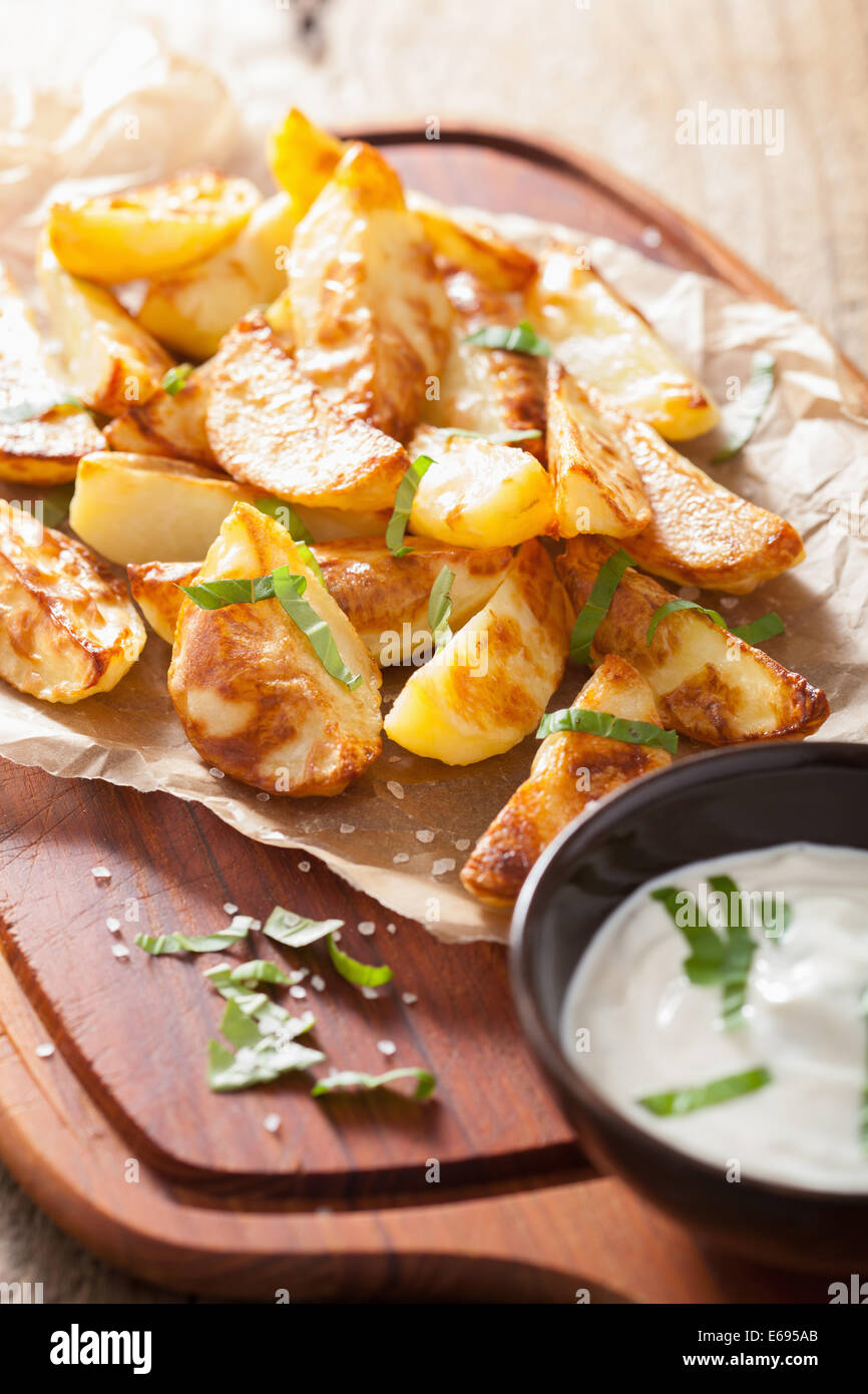 baked potato wedges with yogurt dip Stock Photo Alamy