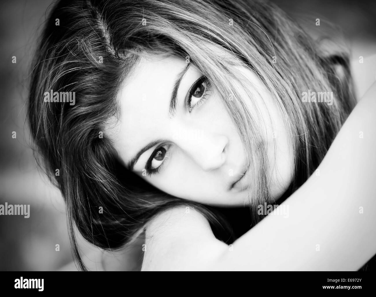 Girl, 15 years, resting her head on her arms Stock Photo - Alamy