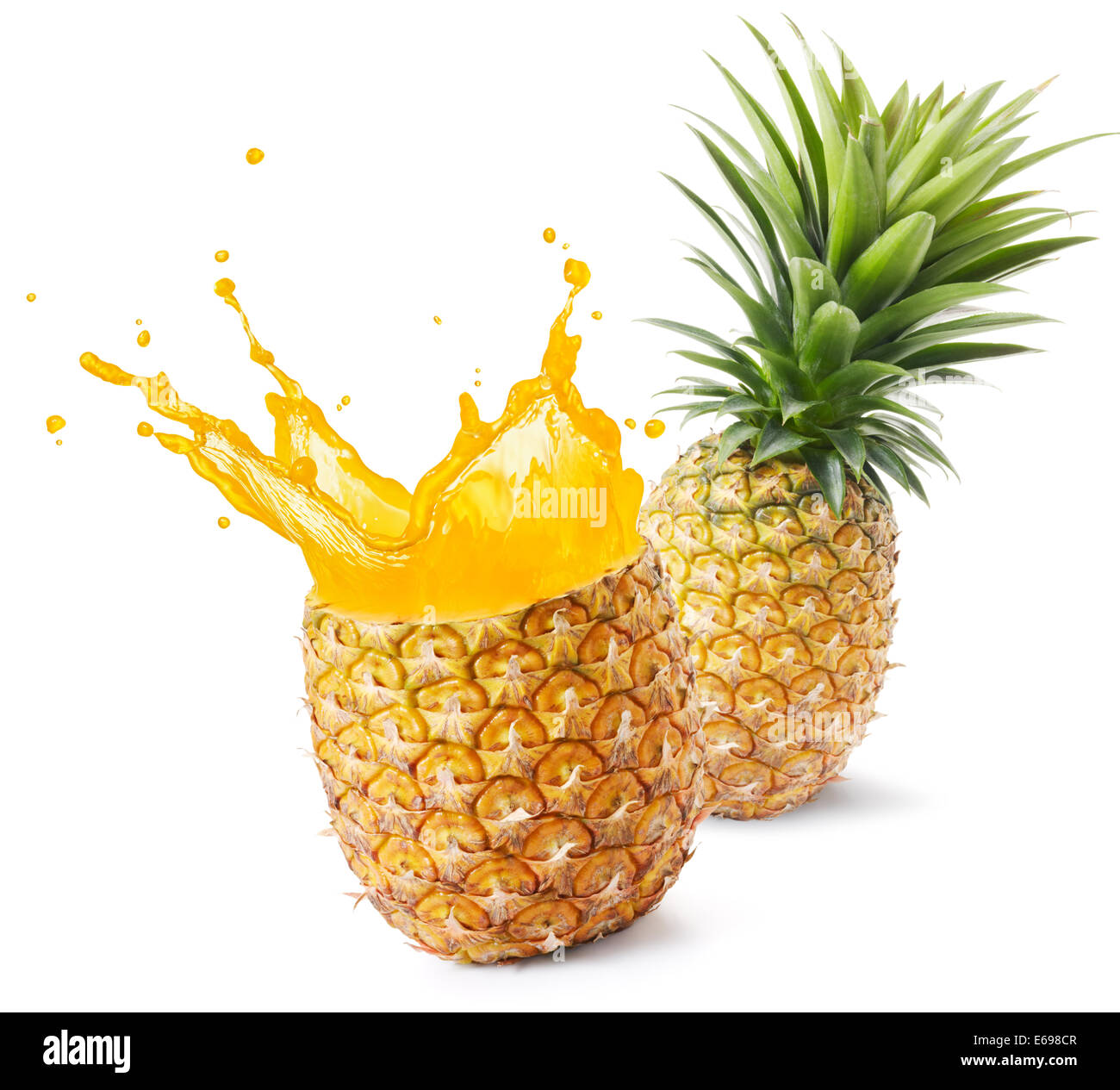 pineapple juice splashing out from its fruit Stock Photo