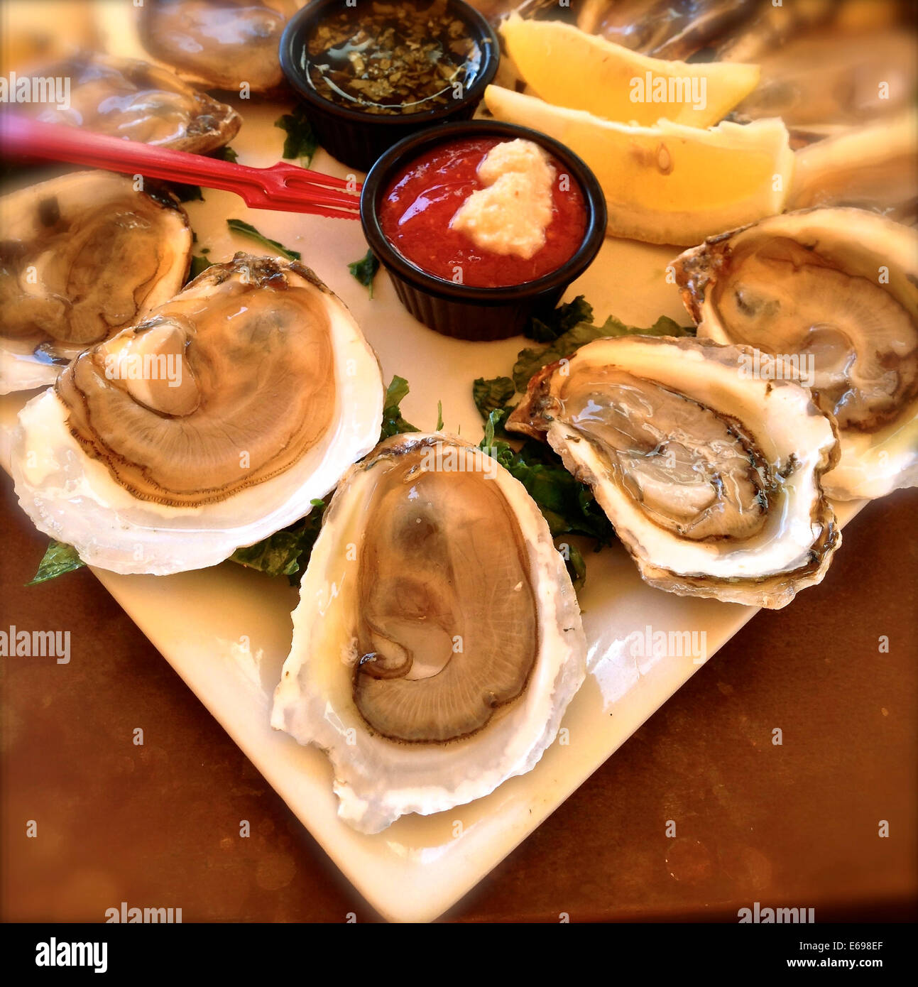 Plate of oysters and sauces - Smartphone Captured Stock Image