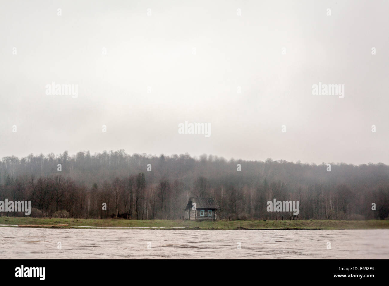 House built by rural river Stock Photo - Alamy
