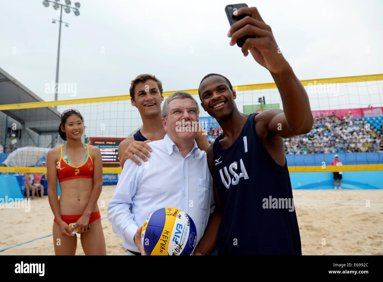 Nanjing China S Jiangsu Province 19th Aug 2014 President Of International Olympic Committee Thomas Bach Takes Selfies With Athletes Of America Louis Richard 1st R And Tj Defalco 3rd R By Their Mobilphones After