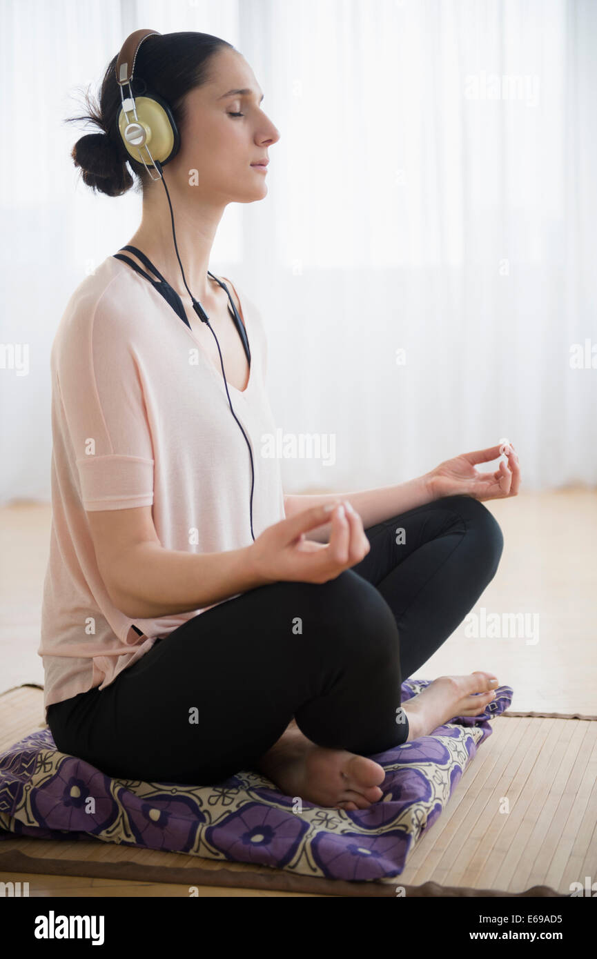 Caucasian woman meditating Stock Photo