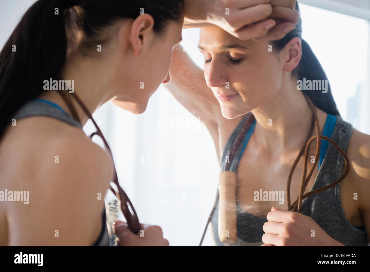 Caucasian woman resting after exercise Stock Photo