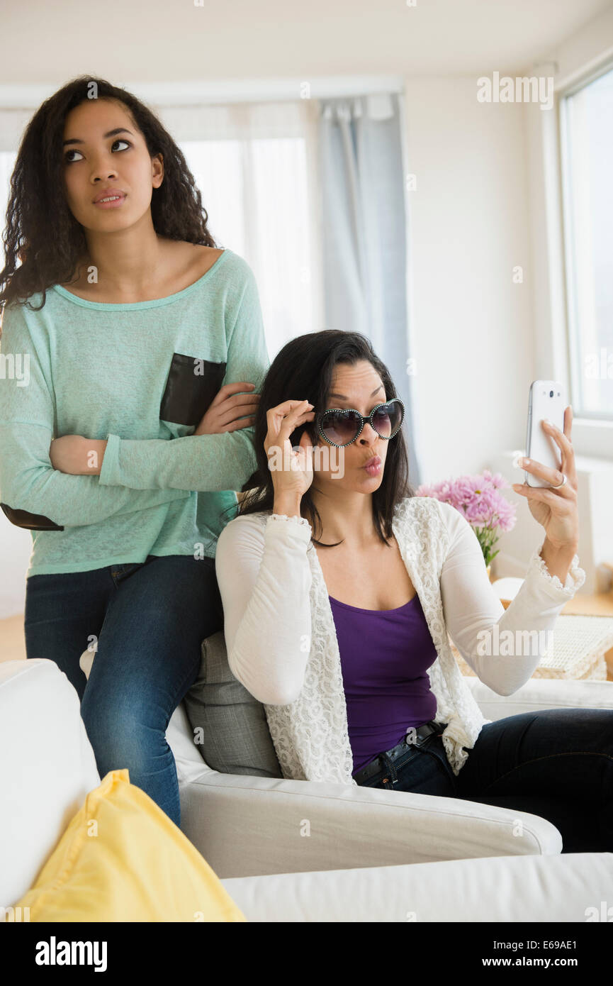 Teenage girl rolling her eyes at mother Stock Photo