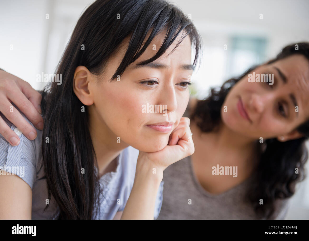 Woman comforting sad friend Stock Photo