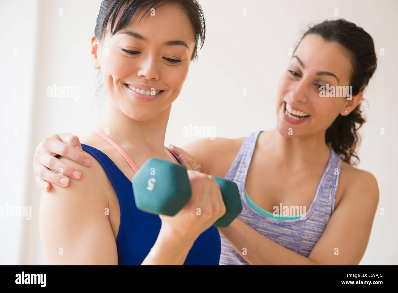 Women exercising together in gym Stock Photo