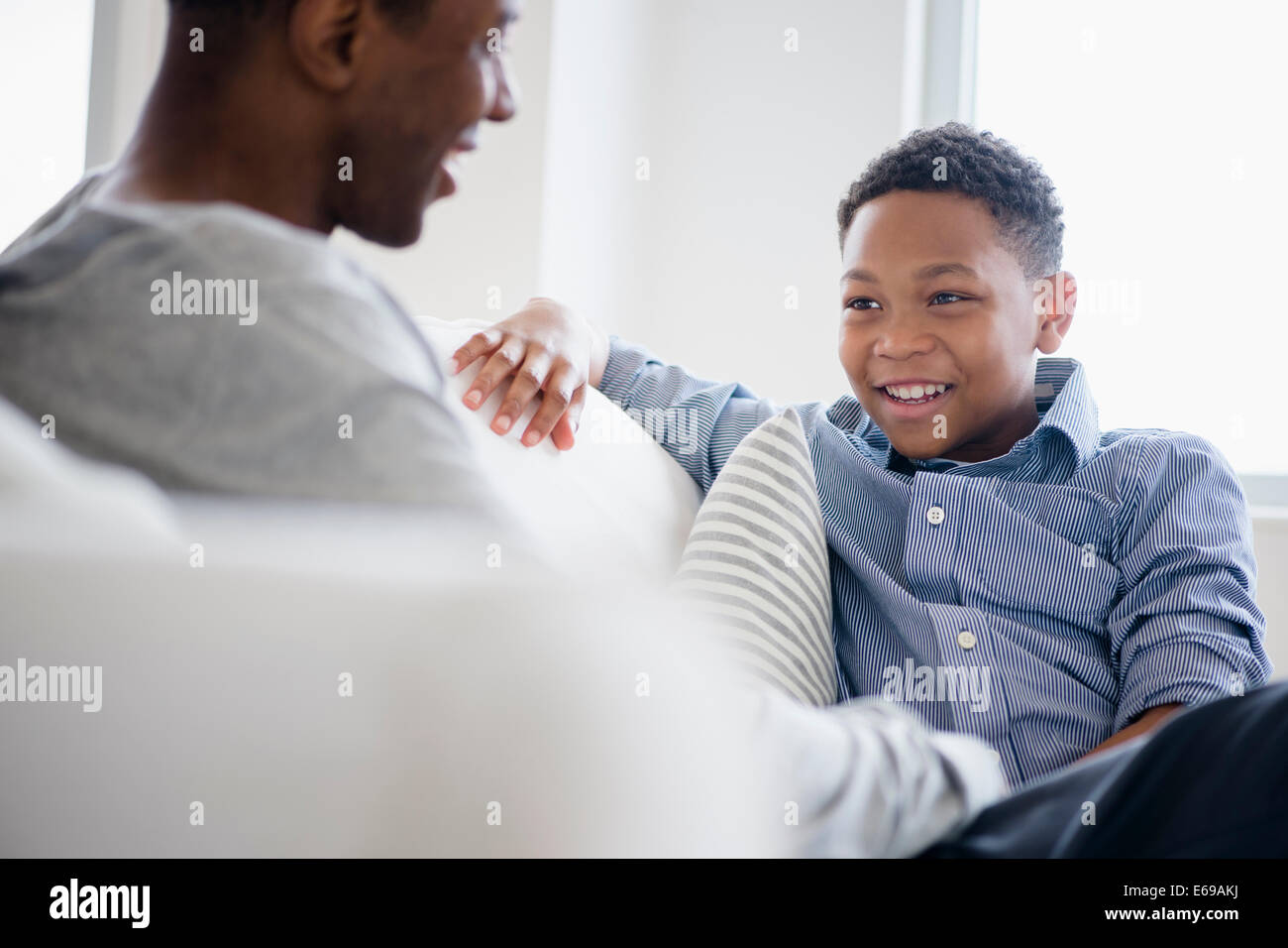 Father son talking sitting hi-res stock photography and images - Alamy