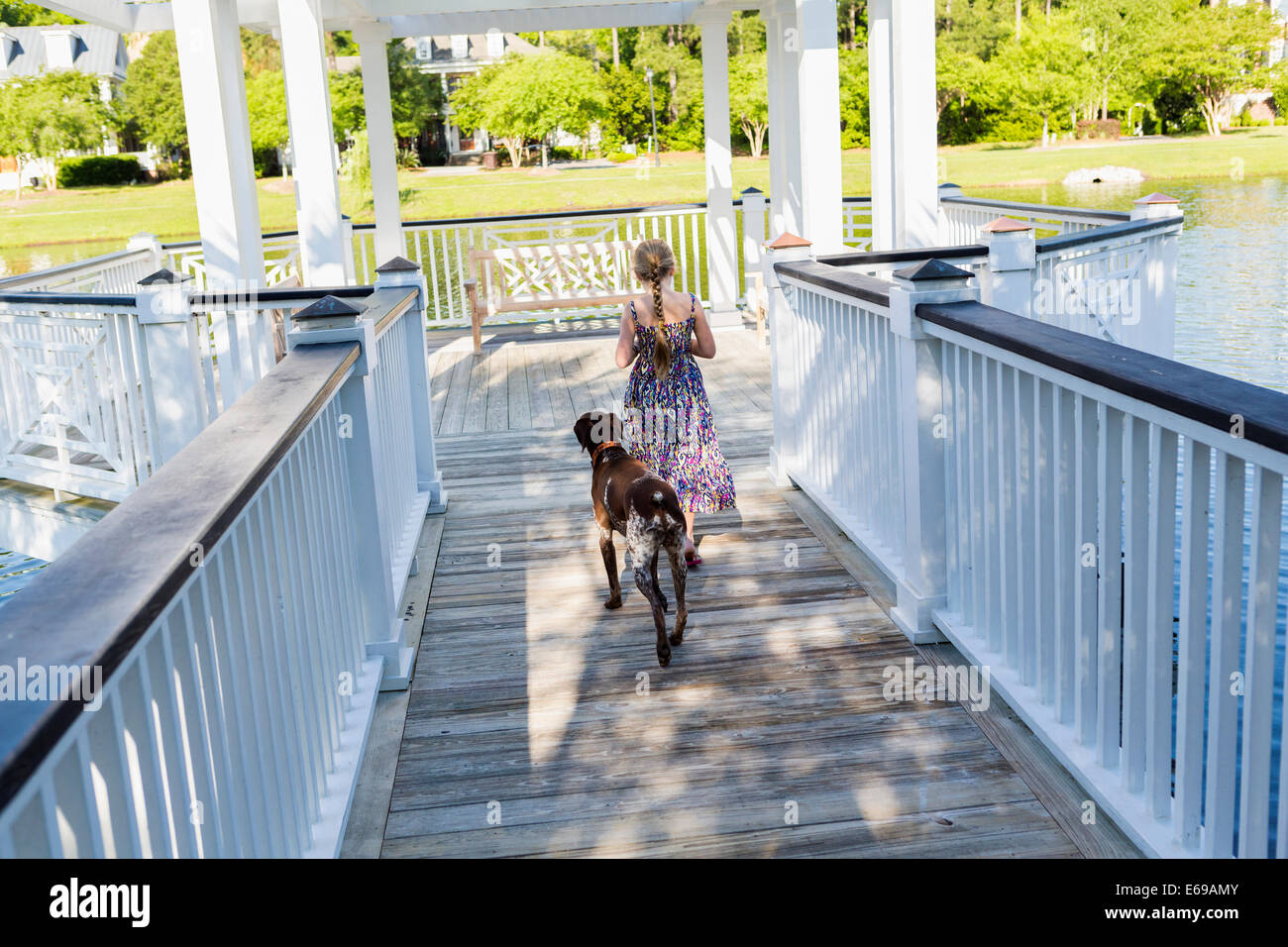 Girl walking dog hi-res stock photography and images - Alamy