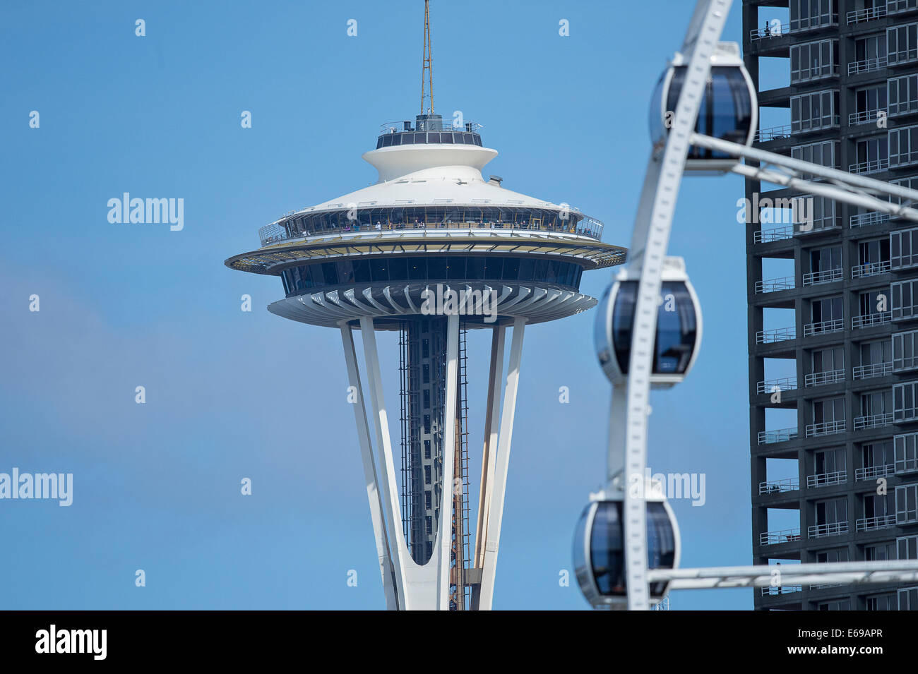 Space Needle overlooking Ferris wheel, Seattle, Washington, USA Stock