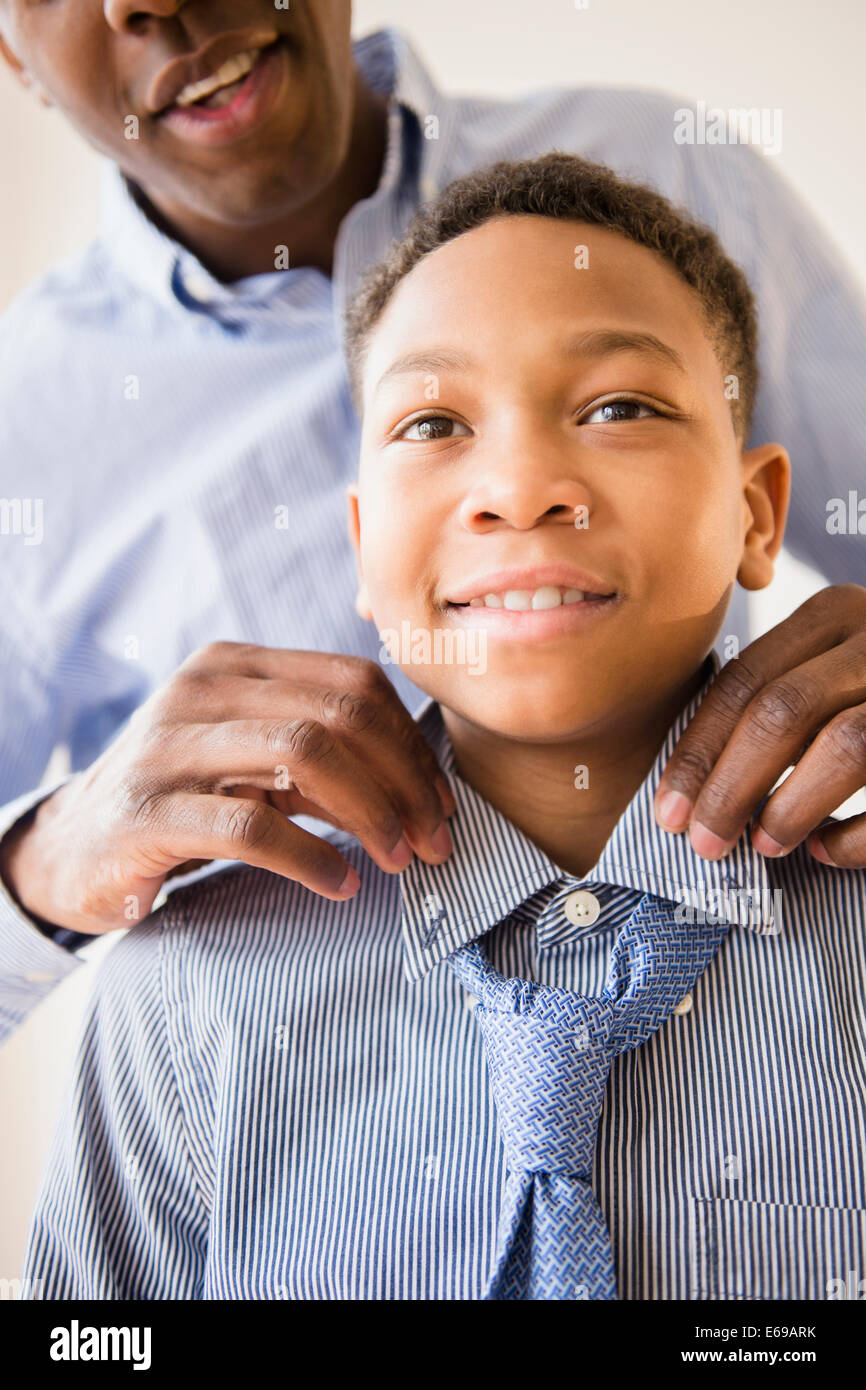 Father adjusting son's tie Stock Photo