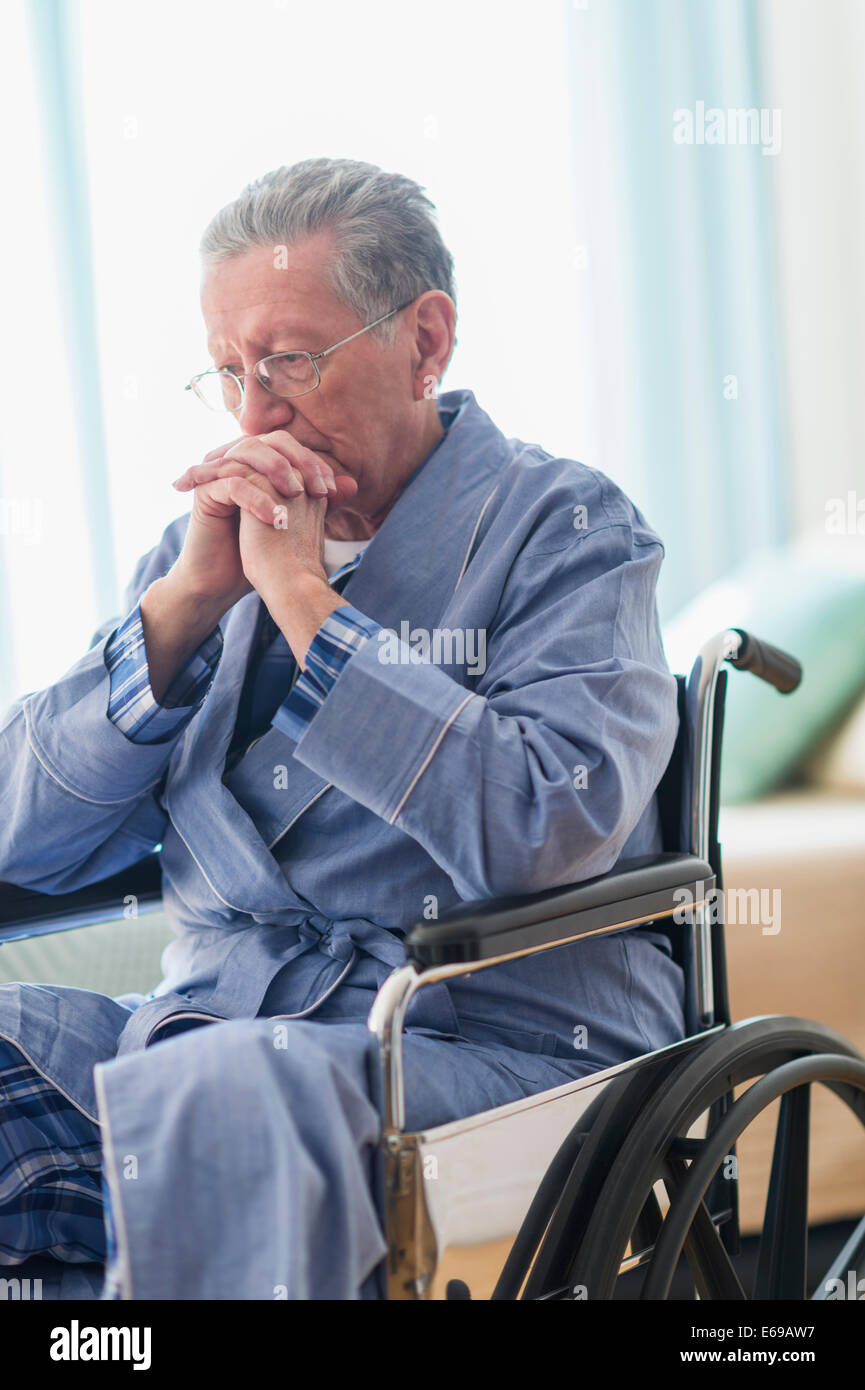 Senior Caucasian man sitting in wheelchair Stock Photo