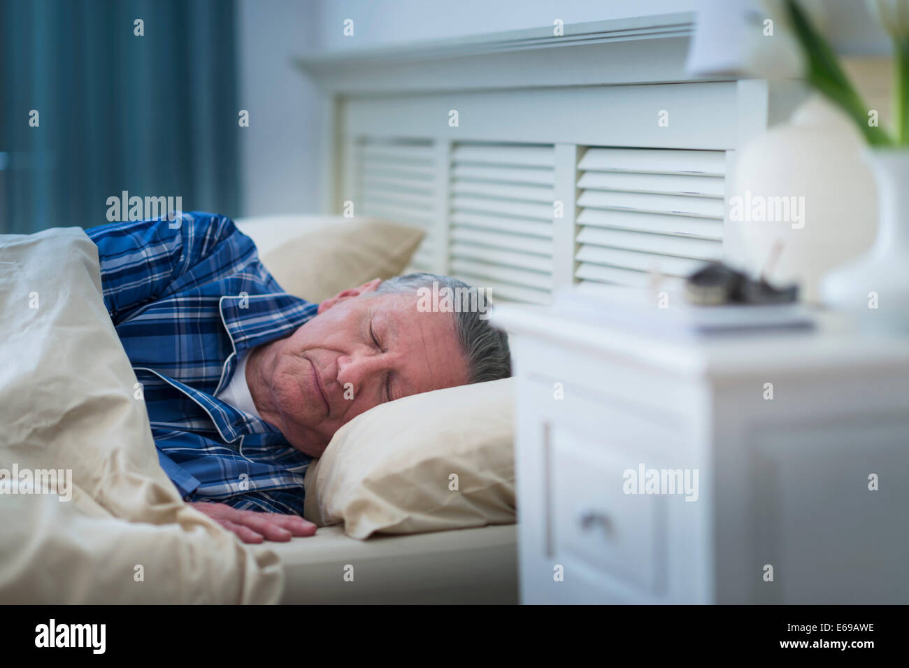 Senior Caucasian man sleeping in bed Stock Photo - Alamy