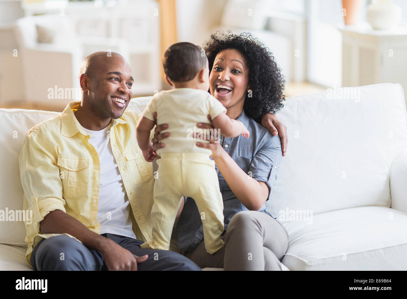 Parents Playing With Baby In Living Room Stock Photo Alamy parents-playing-with-baby-in-living-room-stock-photo-alamy