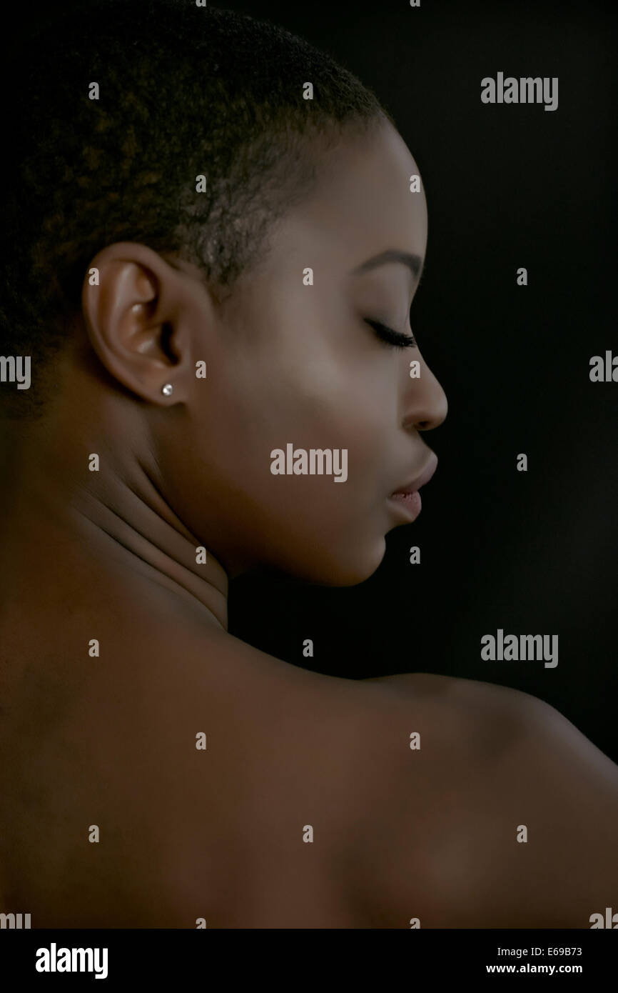 Rear view of black woman with eyes closed Stock Photo