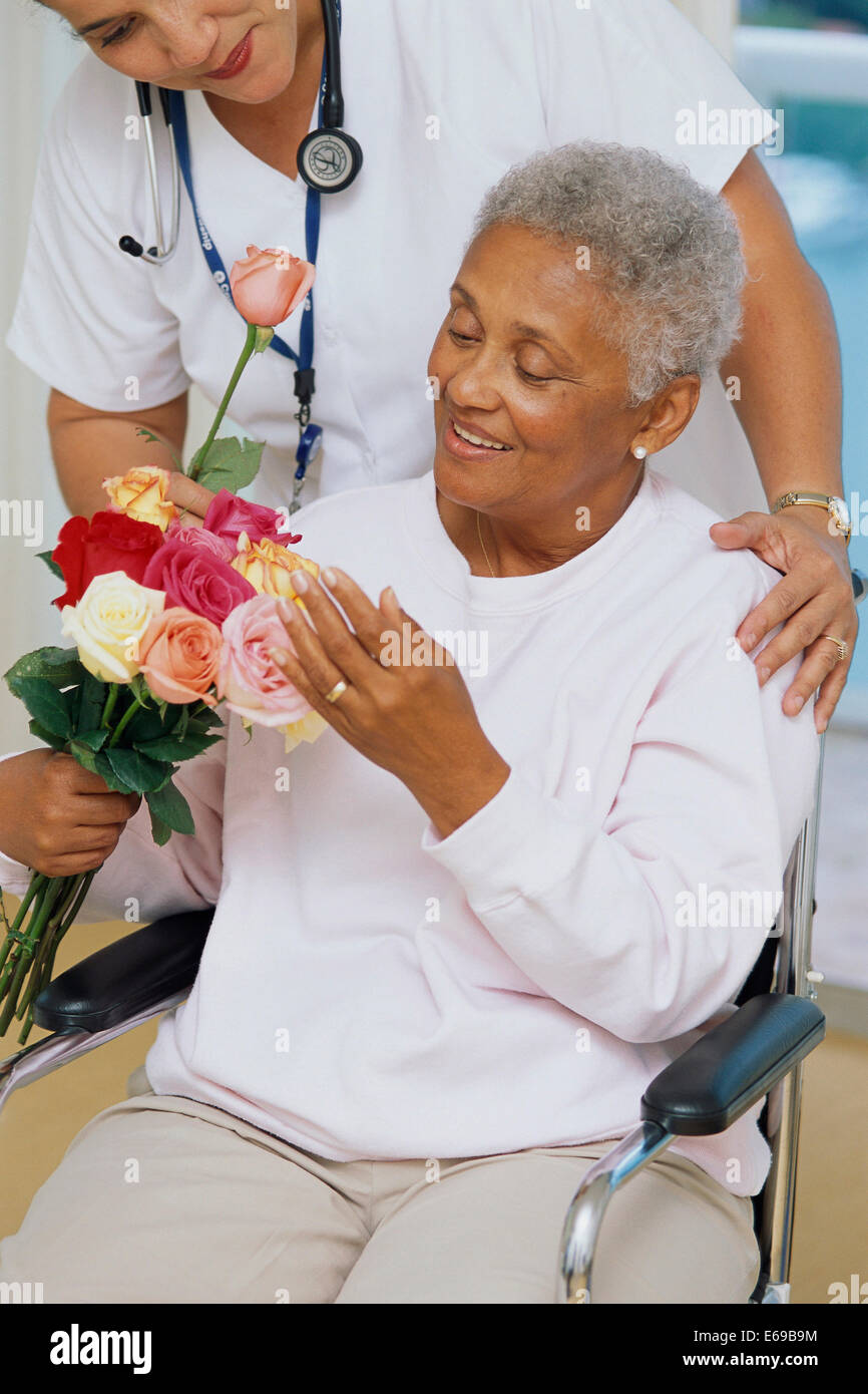 Senior patient getting flowers in hospital Stock Photo Alamy