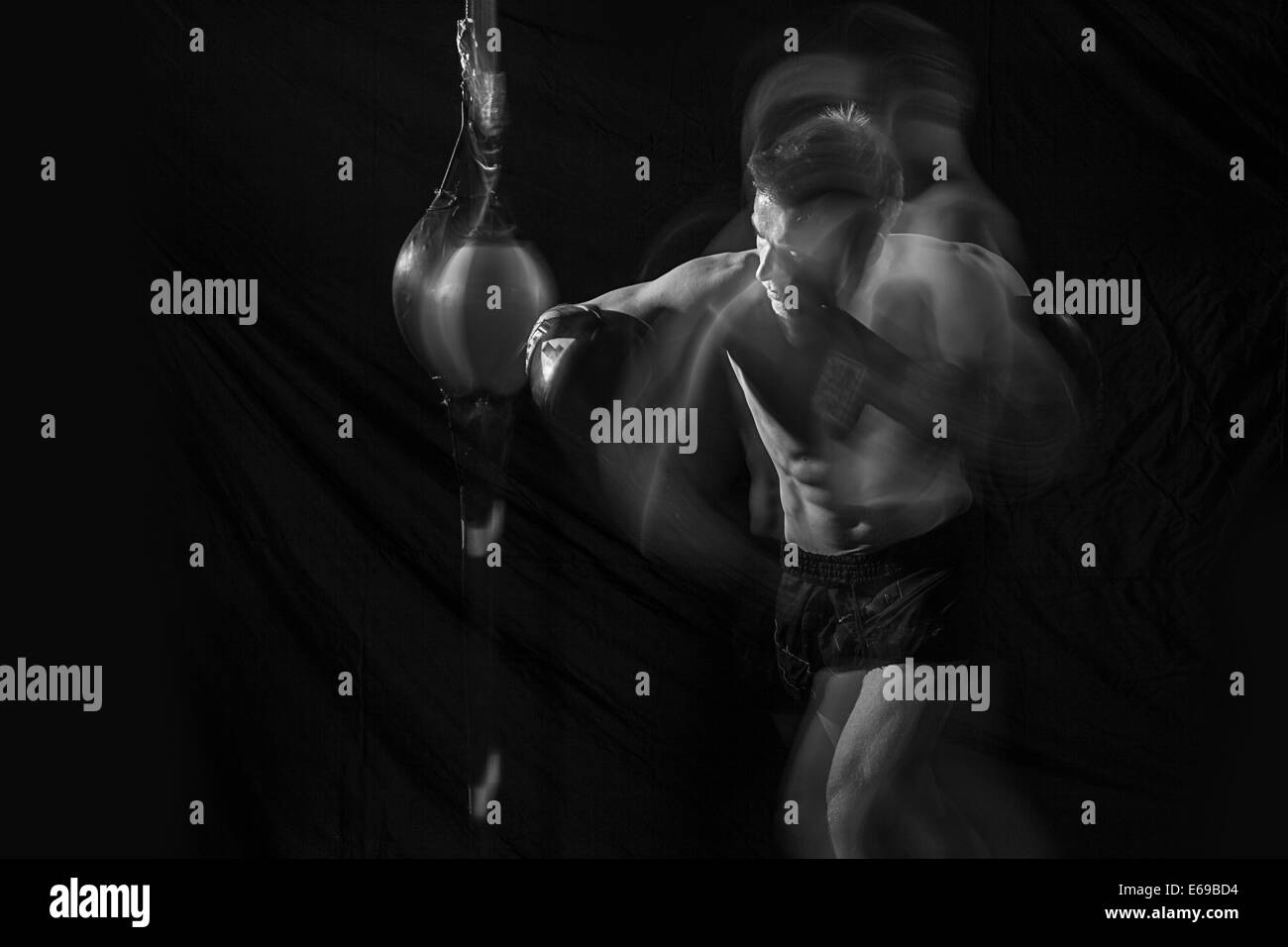 Blurred view of Caucasian boxer training Stock Photo