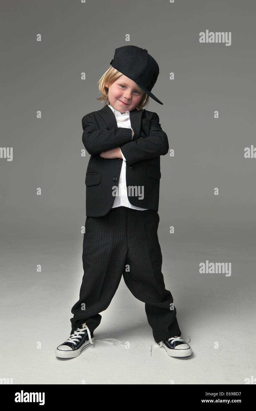 Caucasian boy posing in oversized suit Stock Photo Alamy