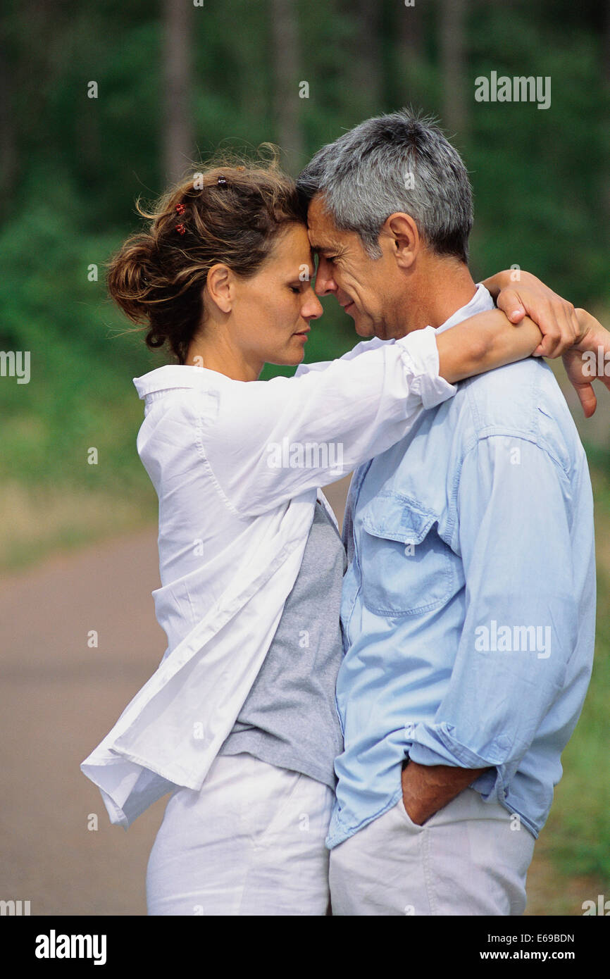 Caucasian couple hugging woman hi-res stock photography and images - Alamy