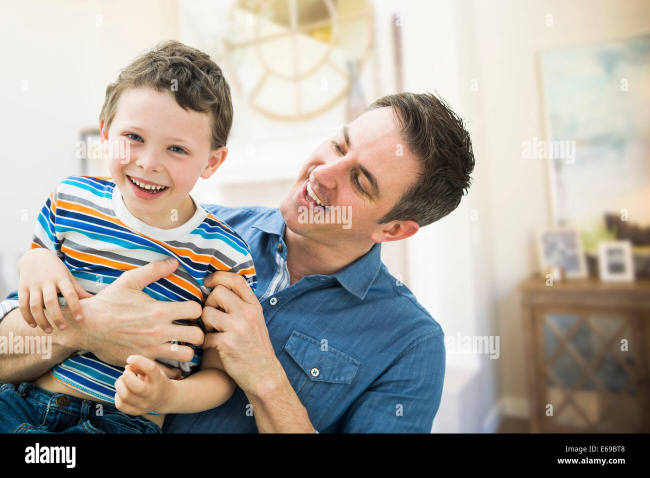 Father tickling son hi-res stock photography and images - Alamy