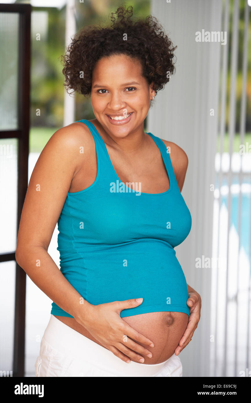Pregnant woman holding her belly Stock Photo Alamy