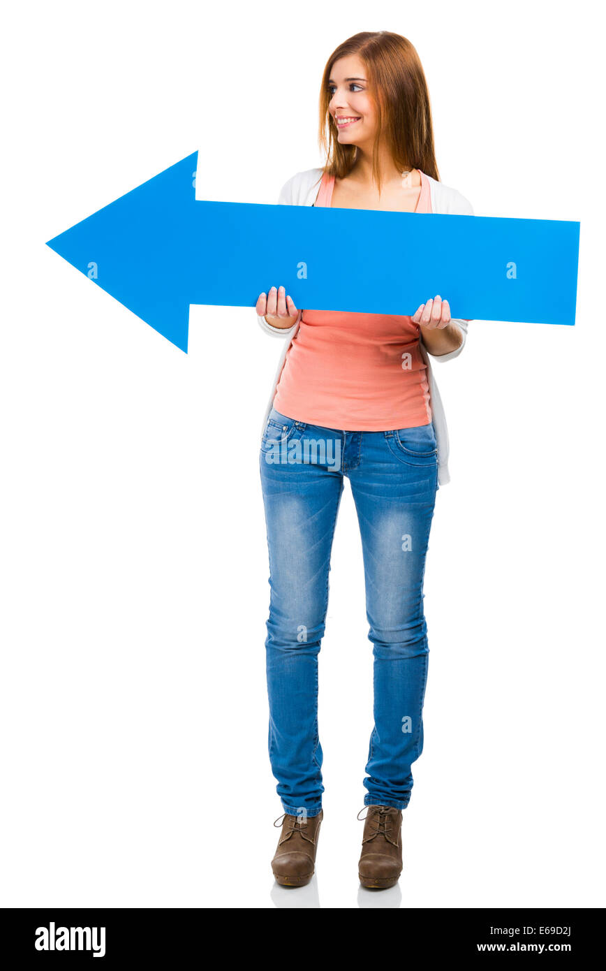 Beautiful woman holding a blue arrow pointing to her left side Stock ...