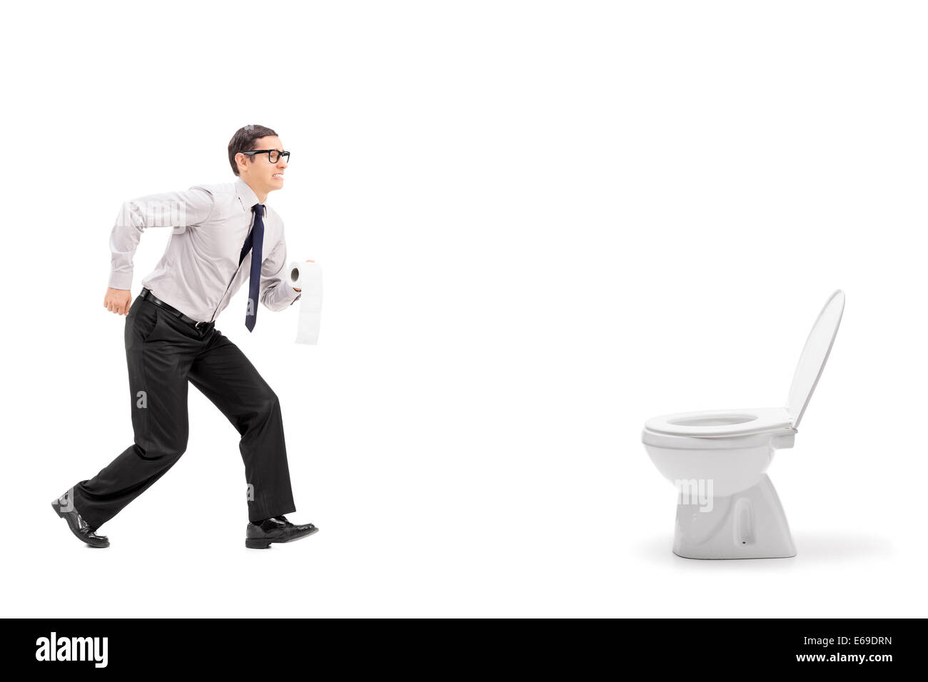 Man rushing to a urinal and holding toilet paper Stock Photo Alamy