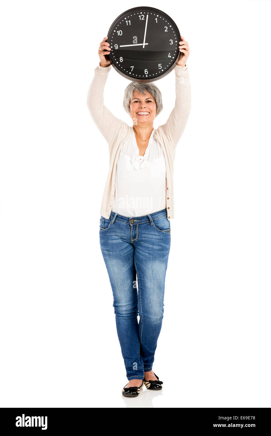 Elderly woman holding a clock, isolated on white background Stock Photo