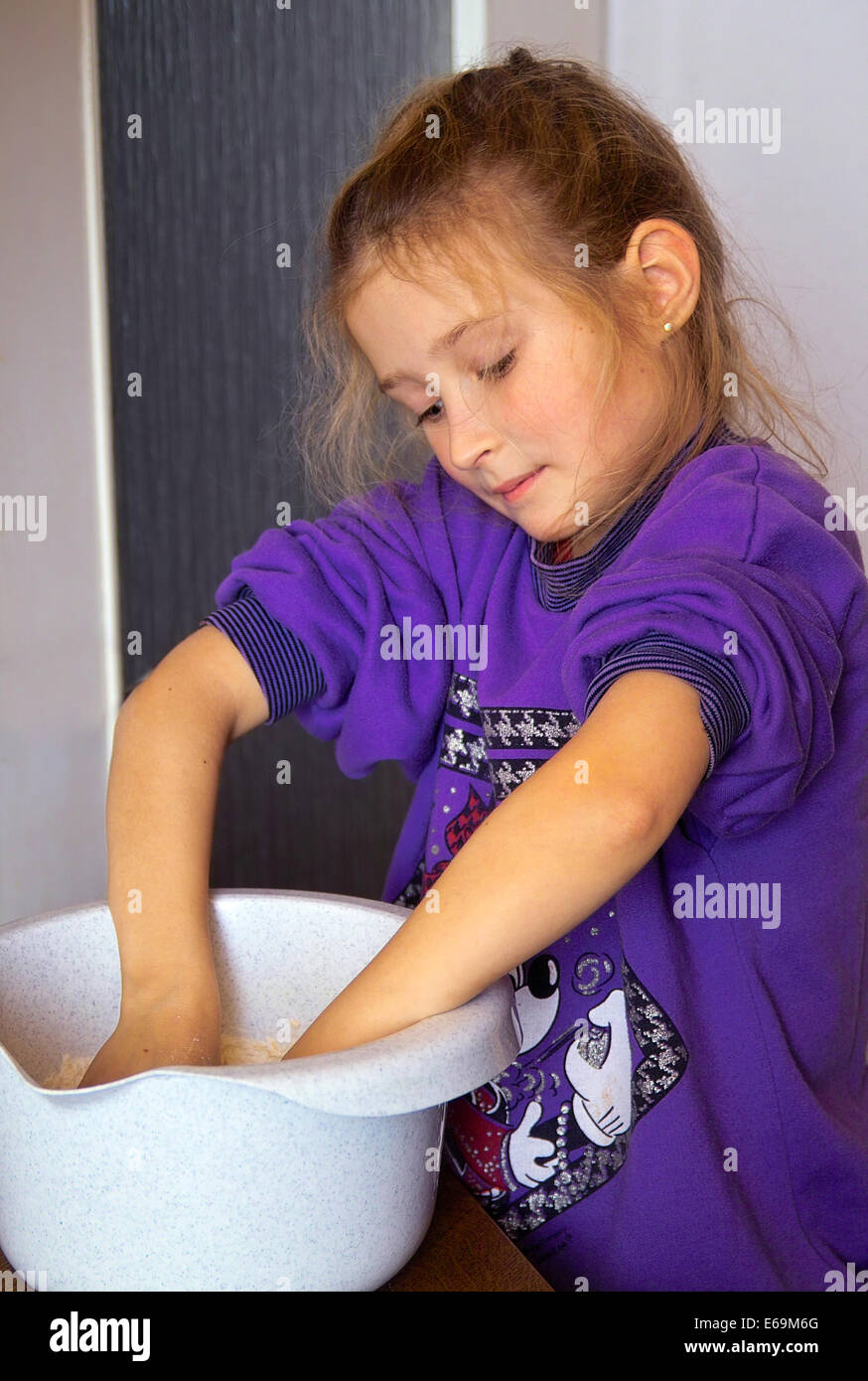 girl,kneading,mixing bowl Stock Photo
