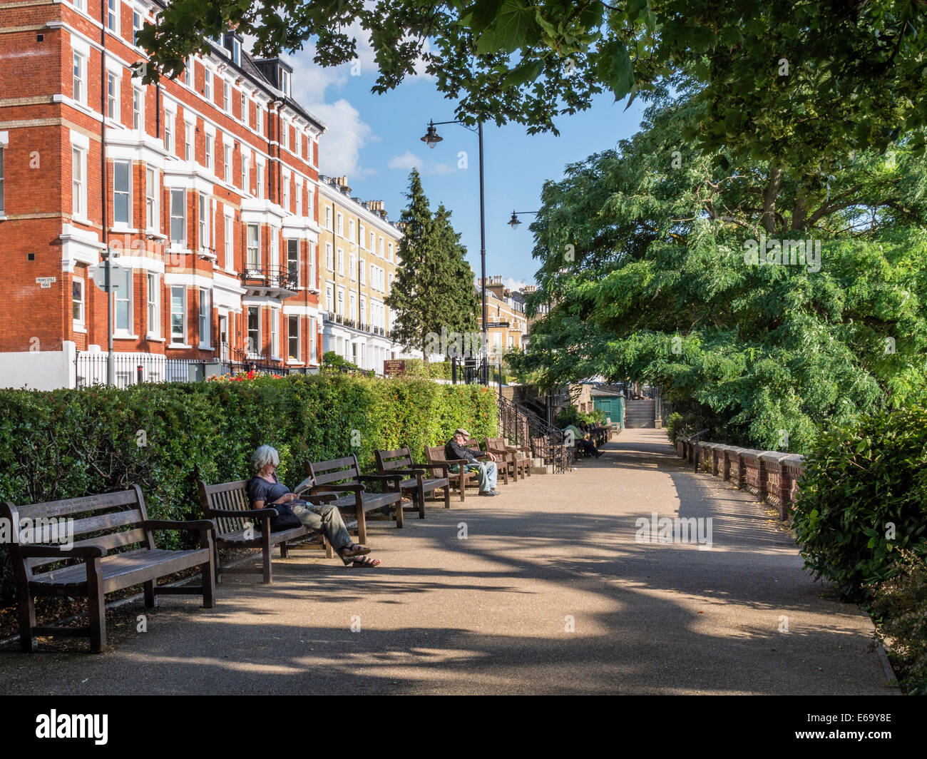 Apartment buildings on Richmond Hill with shady walk and benches