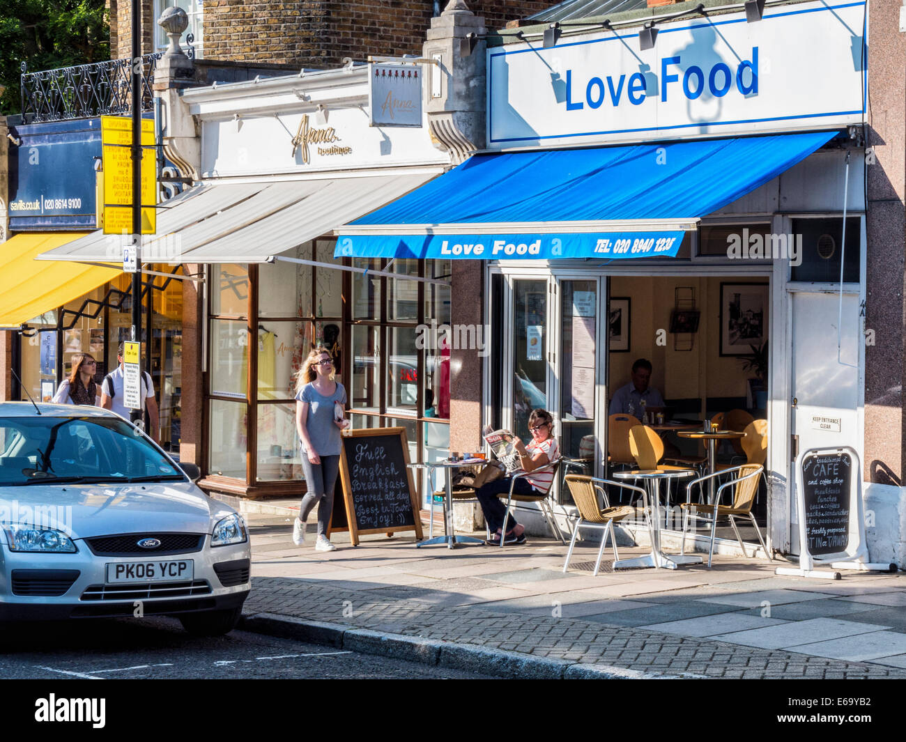 'Love Food' diner exterior with pavement tables in Richmond upon Thames, Surrey, London, UK Stock Photo