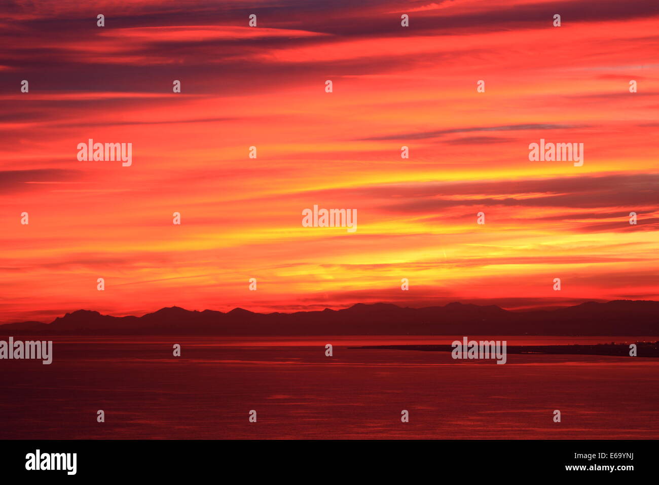 Sunset red sky above the sea in Nice, French Riviera. Stock Photo