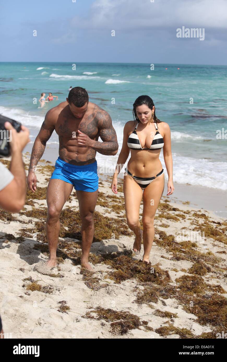 Kelly Brook and boyfriend David McIntosh relax together during their holiday in Miami where they  froliced in the surf before renting out bicycles and rode along South Beach to an outdoor gym.  Featuring: Kelly Brook,David McIntosh Where: Miami, Florida, United States When: 03 Feb 2014 Stock Photo
