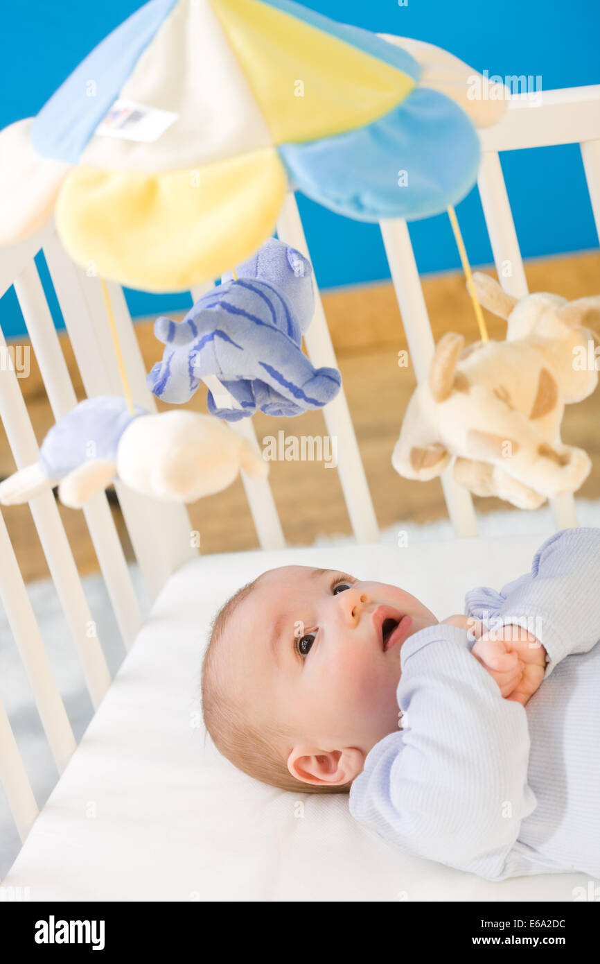 baby,mobile sculpture,cot Stock Photo