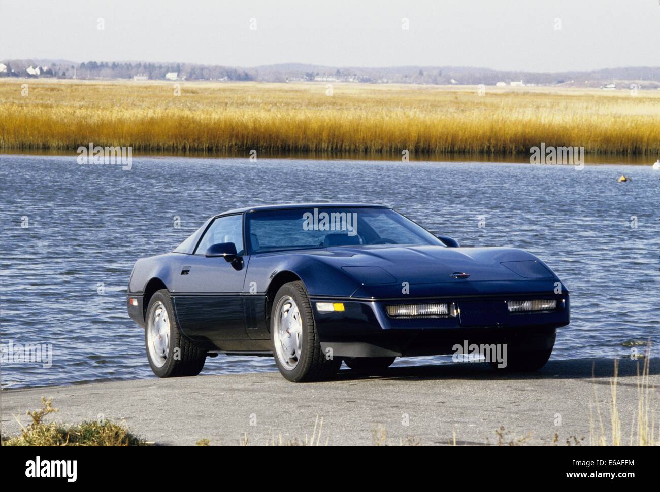 Chevrolet Corvette C4 Callaway modified version - 1988 Model Year MY - showing front and side view against a lake river background backdrop Stock Photo