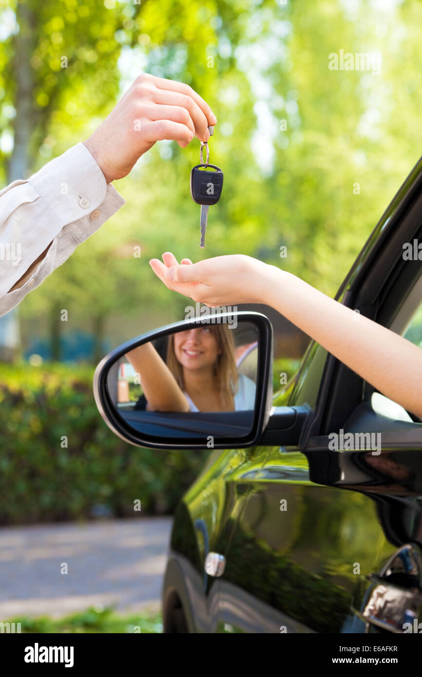 car buying,key handover,car key,driver's license Stock Photo Alamy