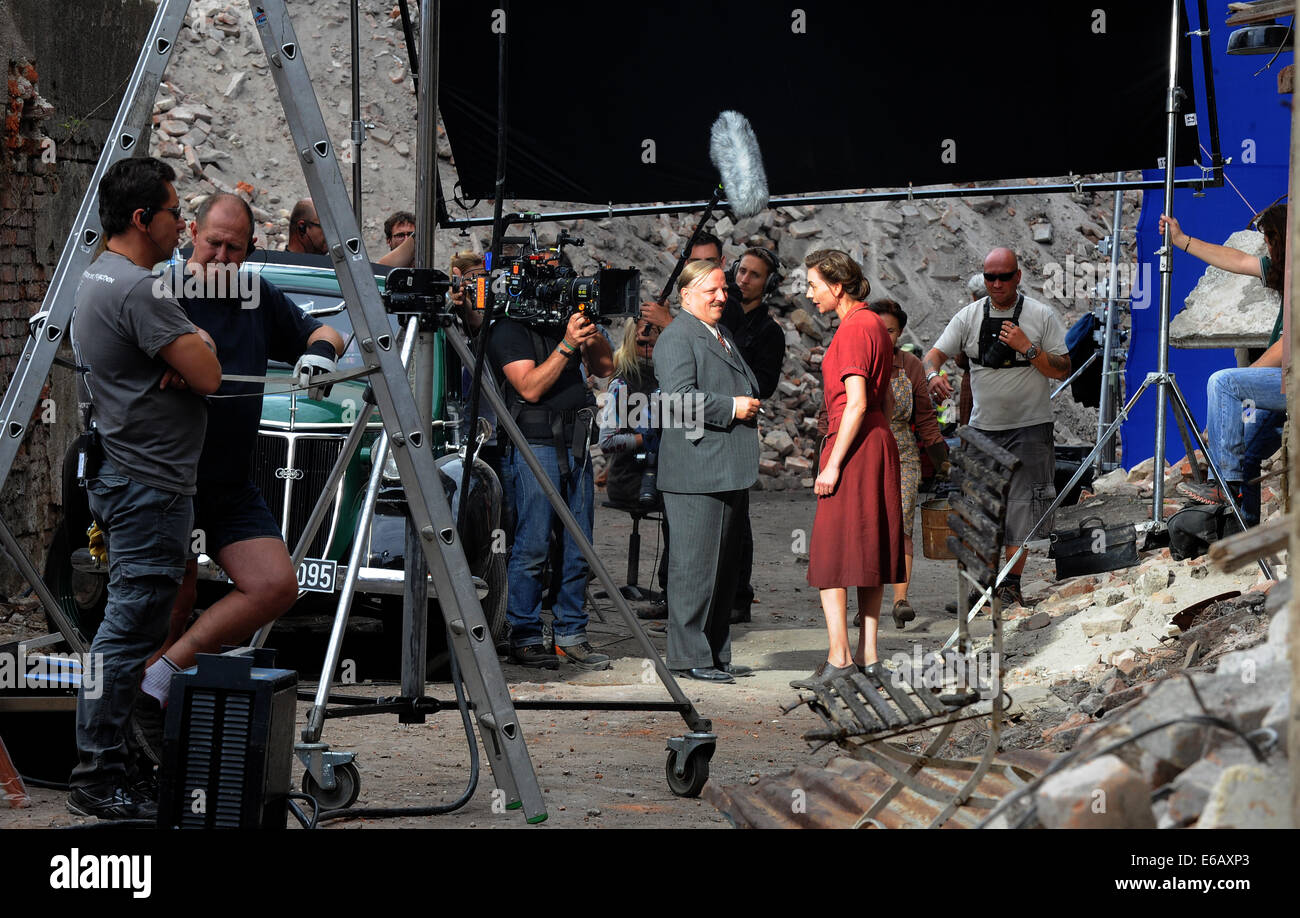Shooting of the German movie for TV channel ARD called Ladder in the sky at the area of demolished sugar refinery in Lenesine, near Louny, Czech Republic on August 19, 2014. Pictured actors Axel Prahl (left) and Christiane Paul. (CTK Photo/Libor Zavoral) Stock Photo